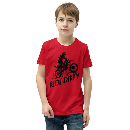 Child wearing a red short-sleeve shirt with black dirt bike graphic and 'Ride Dirty' text